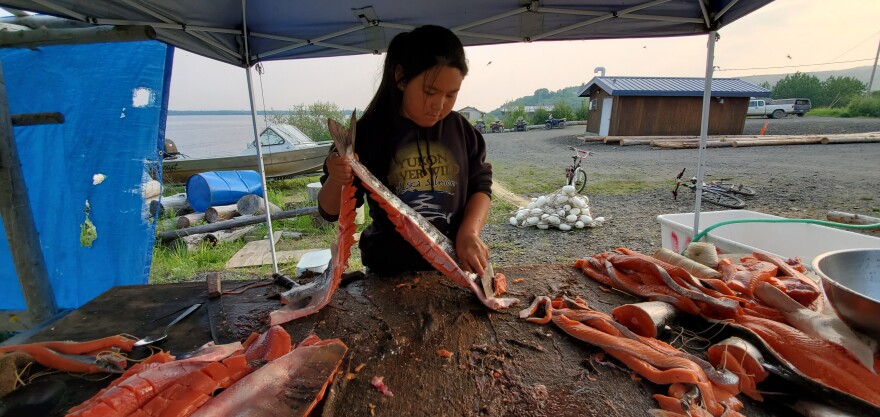 Serena Fitka's daughter, Hali, cutting chum in St. Mary's. June 10, 2020.