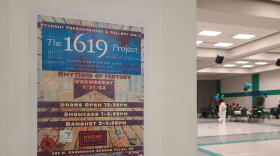A flyer in the Greenwood Cultural Center about a showcase from summer camp attendees based on the 1619 Project.