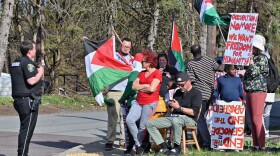 Protesters stood on the corner of Cedar Ave. and Pear St. in Scranton before President Biden spoke at a campaign event at Carpenters Local Union 445.