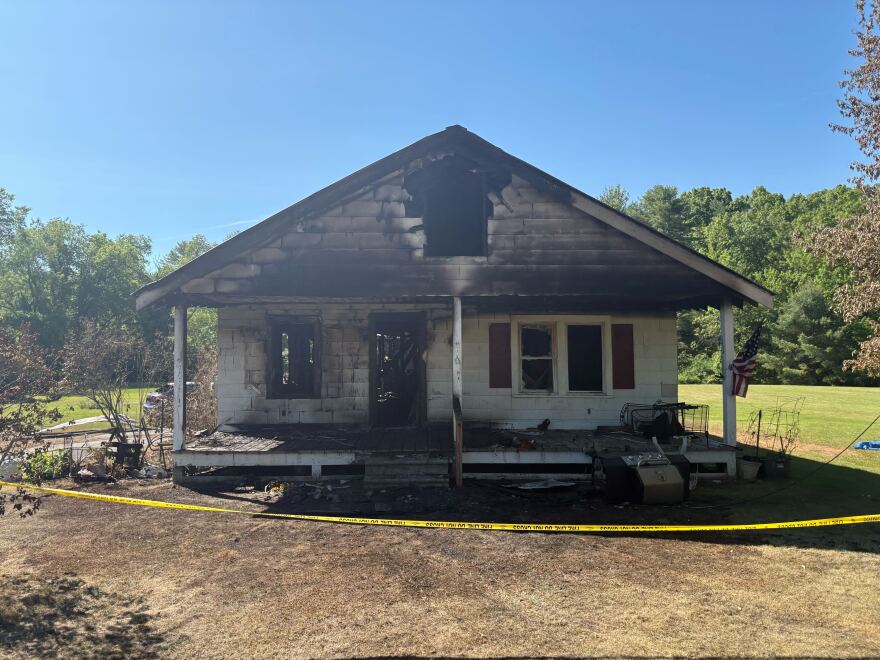 A look on Thursday, June 4, 2026, at the house on Old Saratoga Road in the town of Moreau, New York, that burned two nights earlier. A married couple died in the blaze.