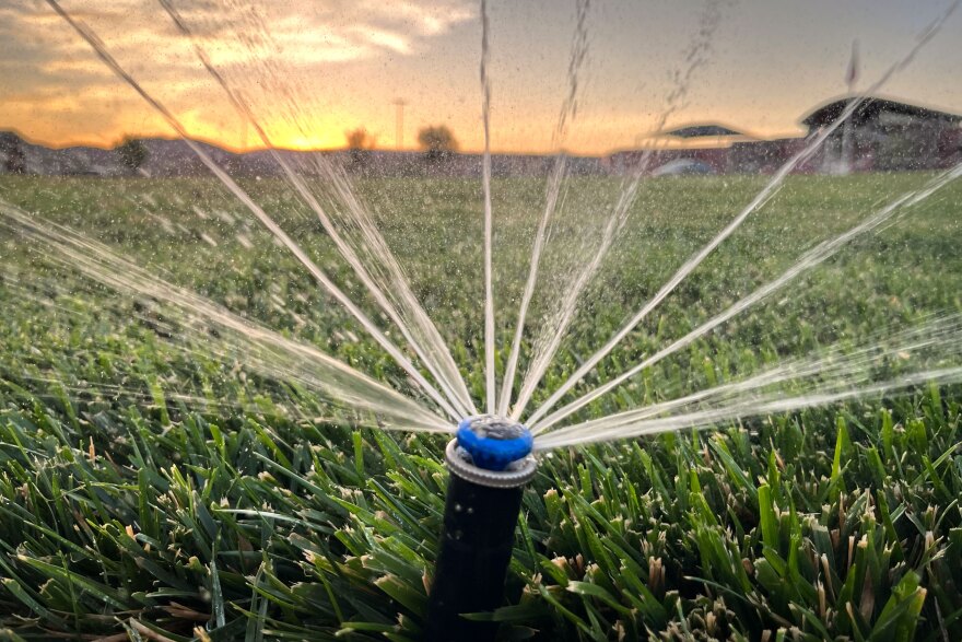 Under the water shortage plan, cities could choose to put limits on outdoor watering. But some grassy areas, like the one seen here Aug. 7, 2025, outside a St. George school, may be exempt from restrictions because they use recycled wastewater.