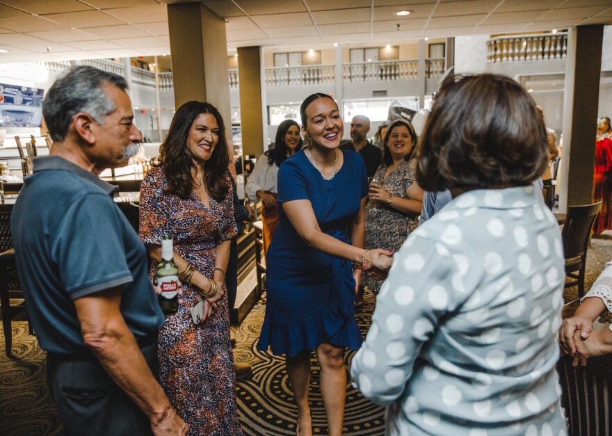 Michelle Vallejo greets voters at an event during the Democratic Primary runoff election.