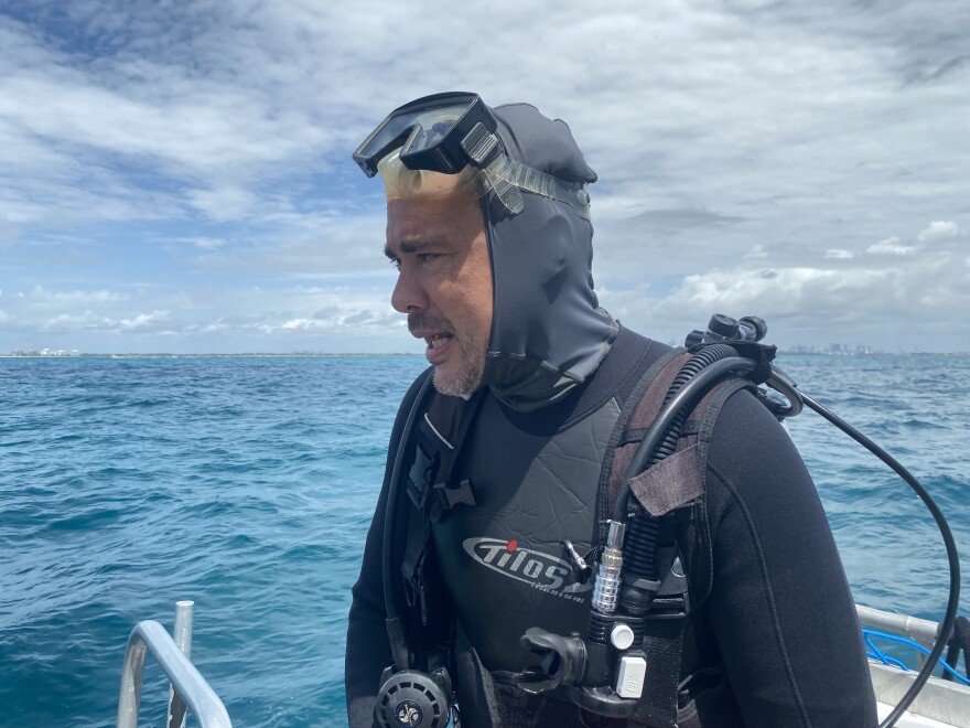 This is Andrew Baker, professor of marine biology and ecology at the University of Miami’s Rosenstiel School and Director of the Coral Reef Futures Lab, moments after planting the crossbred coral in Biscayne Bay.