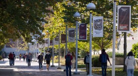 Students walking on the Missouri State University campus on a fall day.