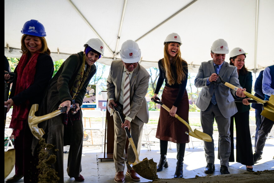 Beth-El Center Executive Director Jennifer Paradis (4th from left) joins officials “as they break ground” during a ceremony on October 19, 2026 celebrating the forthcoming construction of the Beth-El Center n Milford.
