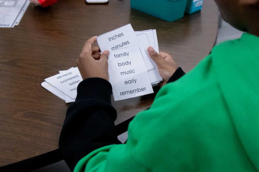 A fifth grade student at John Burroughs Elementary races through reading as many words as he can before teacher Angie Carney's buzzer sounds.