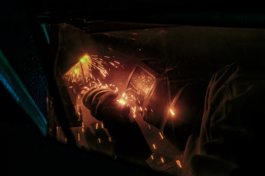 A Joint Task Force-Red Hill contractor uses a stick weld on a support beam during repairs at the Red Hill Bulk Fuel Storage Facility on April 25, 2023.