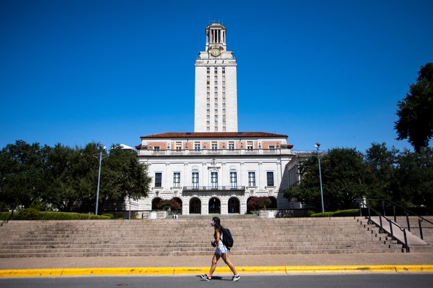 A UT Austin student wears a face mask on campus in October.