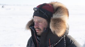 A man in a fur-ruffed parka