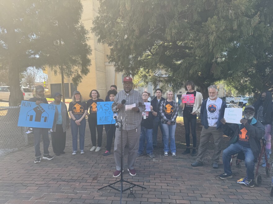 A photo of Crystal Towers residents at a press conference in February