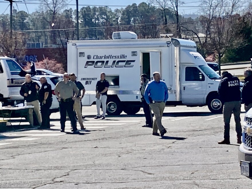 Dozens of city, county and state police converged on a parking lot in Charlottesville to take down a man with a gun