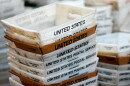 In this 2017 file photo, boxes for sorted mail are stacked at the main post office in Omaha, Neb.