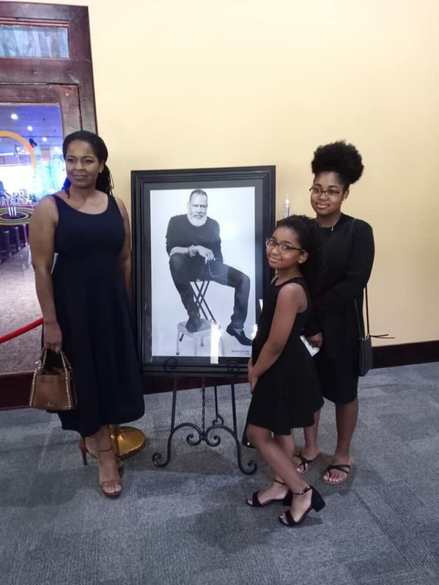 Aunkule Benford Campbell (left), widow of jewelry and fashion designer Mark Anthony Campbell, and their children Laila (center-right) and Aunya Campbell. 