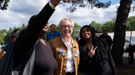 Oregon Gov. Tina Kotek poses for a selfie at the Oaks Amusement Park in Portland, Ore., where several unions held a Labor Day picnic on Sept. 7, 2026. Kotek spent part of Monday campaigning at the picnic and mingling with other election candidates ahead of the November primary.