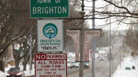 Traffic moves along Monroe Avenue in Brighton, N.Y., where the state Department of Transportation has proposed a resurfacing project that would reconfigure much of the corridor, add improved crosswalks, and potentially lower the speed limit to improve safety for drivers, pedestrians and cyclists.