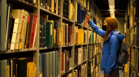 A student picks out a library book