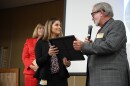 Laurel Blackburn receives an award from School Board Chair Armor Persons as Superintendent Denise Carlin looks on.