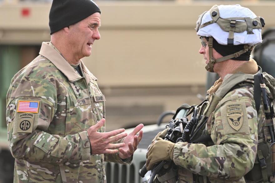 Gen. Charles Flynn, commander of U.S. Army Pacific, talks with Col. Jody Shouse, who commands the 11th Airborne's 2nd Infantry Brigade Combat Team (Airborne), during the JPMRC training exercises conducted in the Yukon Training Area and elsewhere around Fort Wainwright.