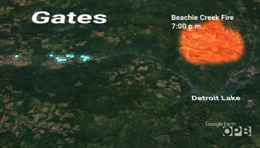 A map illustrating the location of 911 calls reporting power line problems with blue dots in and around the town of Gates on Sept. 7, 2020, relative to the heat map location of the Beachie Creek Fire in Willamette National Forest.