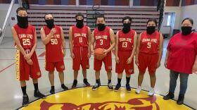 (L-R) Moody Barr, Micah Wells, Ryan Atoruk, Joseph Barr, Alec Mills, Fannie Williams and Coach Shirelle Barr of the Kiana Lynx.