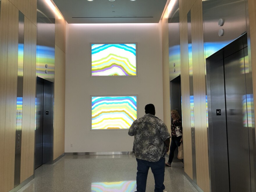 Two light boxes by famed artist Spencer Finch greet guests by the elevators of the Taussig Cancer Center.