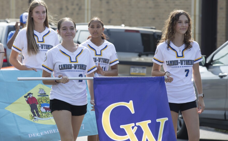 Softball players representing Delaware walk in the parade for the East Region Junior Little League Softball Championship in Nanticoke on Wednesday.