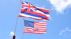 The U.S. flag is captured next to the Hawaiʻi state flag on Maui.