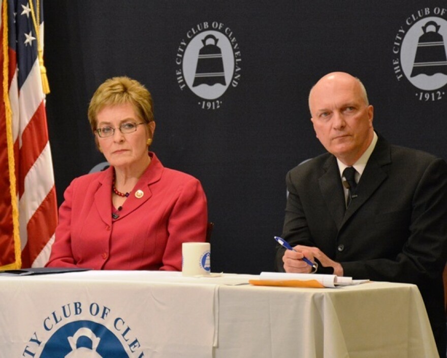 Rep. Marcy Kaptur and Richard May listen to an audience question. (Nick Castele / ideastream)