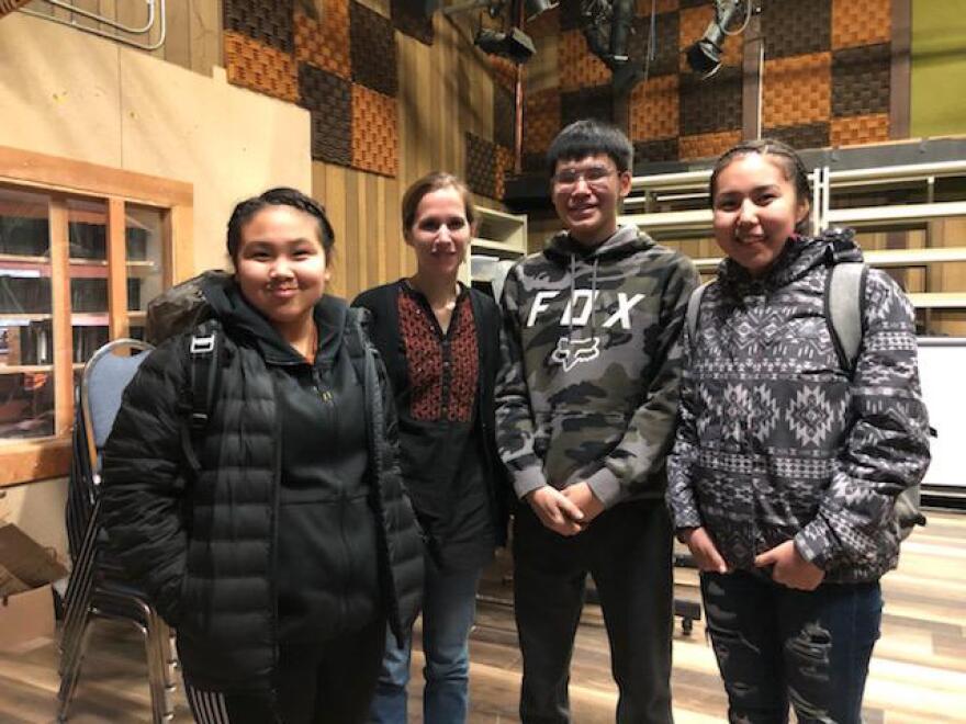 Catharine Axley poses with KYUK interns during her visit to Bethel last week to show her documentary about legendary sprint musher George Attla. Credit KYUK