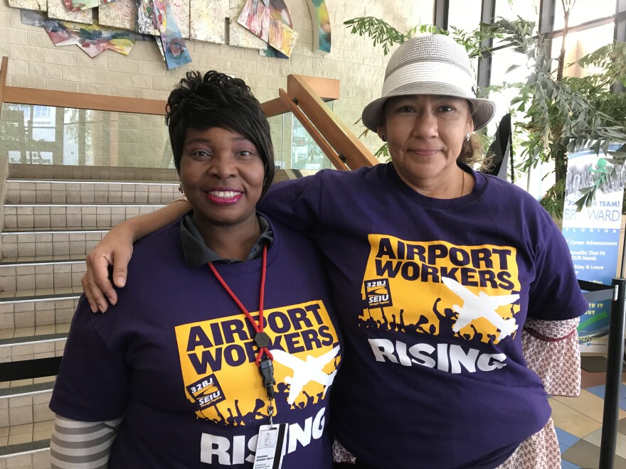 two women wearing airport workers rise t shirts