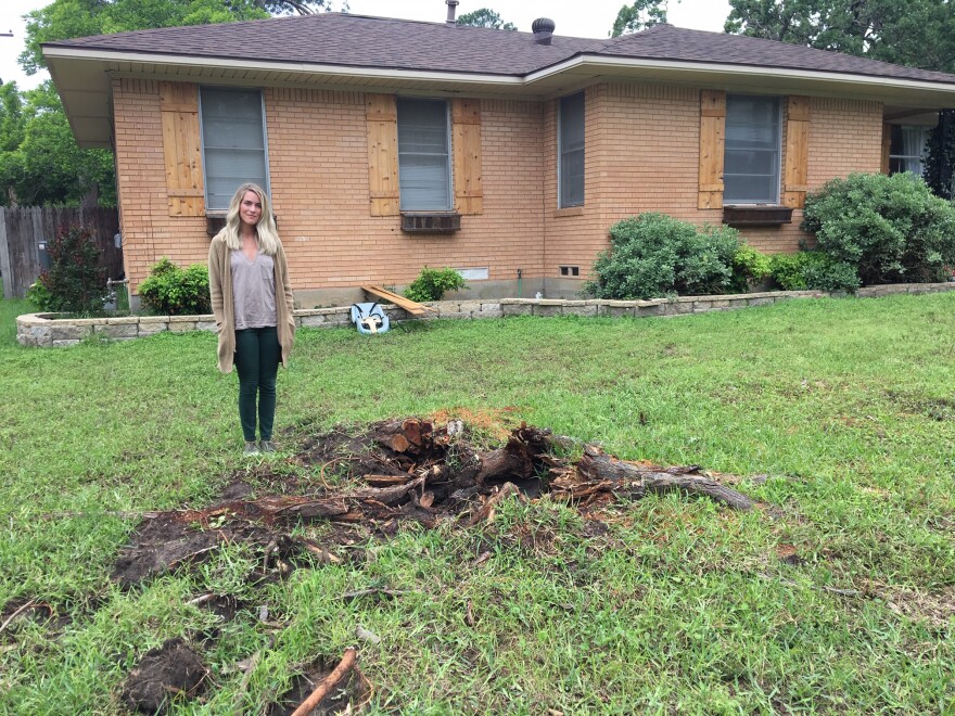 Taylor Moran stands in her yard a little less than two weeks following the tornado.