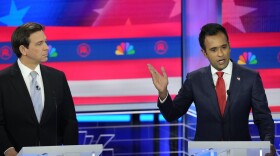 Republican presidential candidate businessman Vivek Ramaswamy speaks as Florida Gov. Ron DeSantis listens during a Republican presidential primary debate hosted by NBC News, Wednesday, Nov. 8, 2023, at the Adrienne Arsht Center for the Performing Arts of Miami-Dade County in Miami.