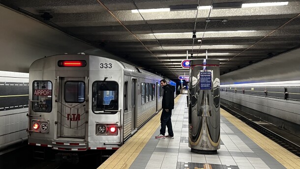 A passenger about to board a GCRTA Rapid Transit rail car at the Cleveland Hopkins International Airport.