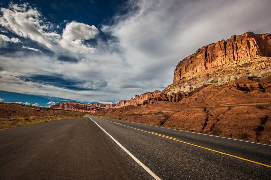 Highway leading into a red rock canyon in Utah