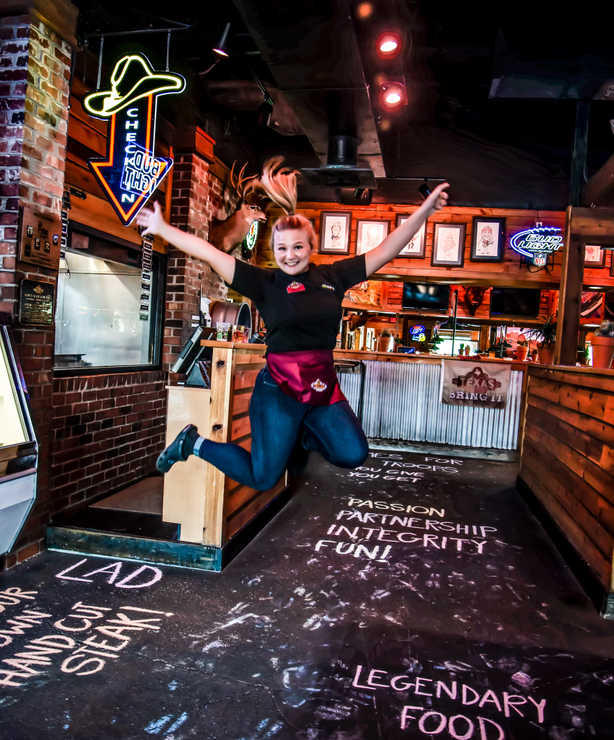 An excited employee of Texas Roadhouse, which has over 700 locations in every state but Hawaii.