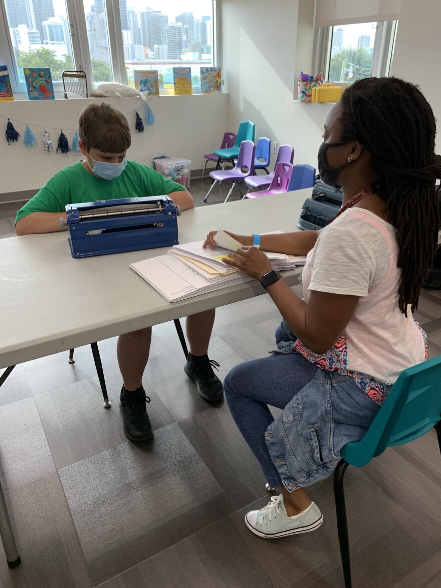 Jeremy "JJ" Matthews, 9, of Miami, participates in braille literacy testing at the Miami Lighthouse for the Blind as part of an international competition called the Braille Challenge.