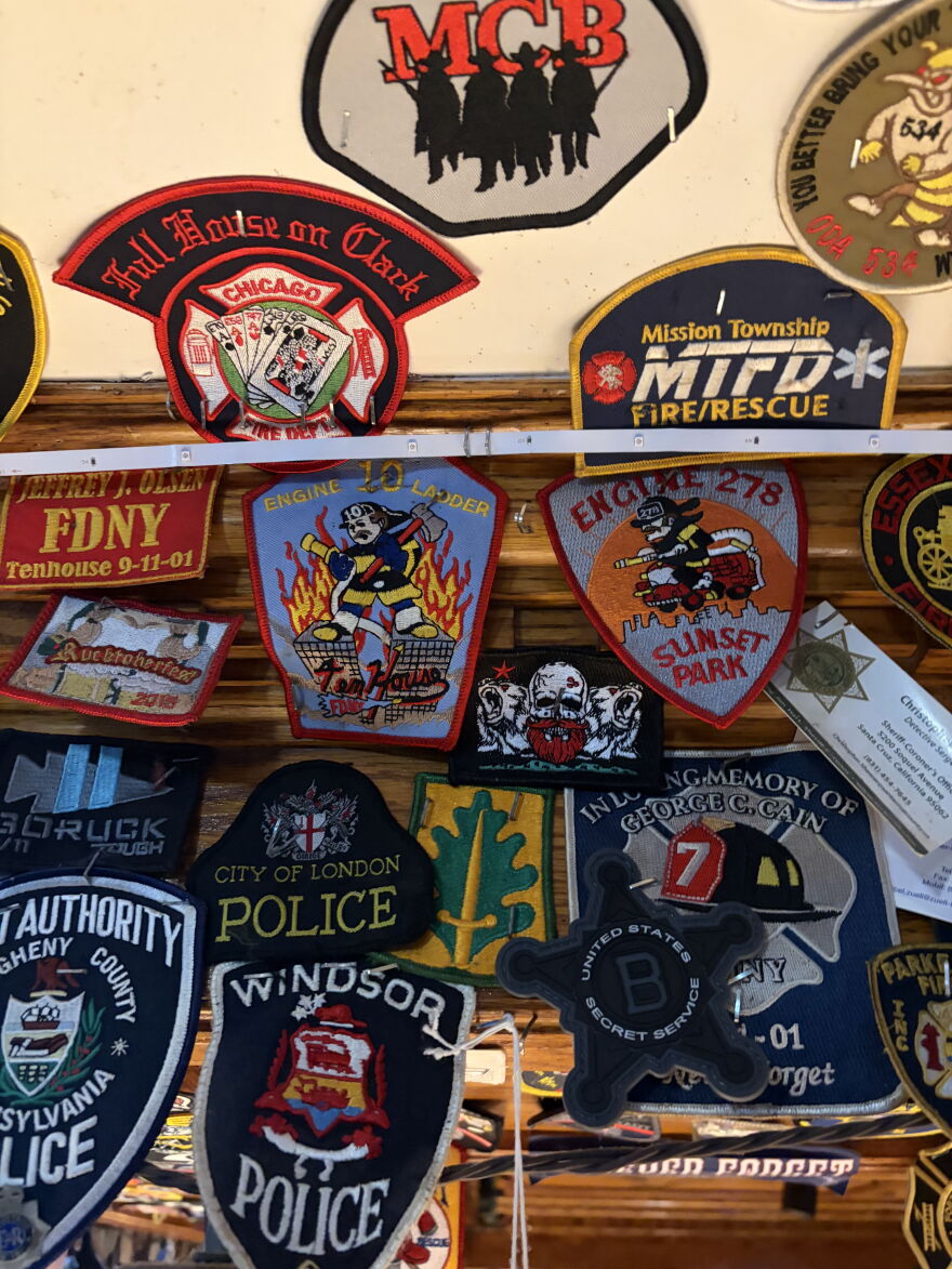 Patches from fire departments and police forces across the country and around the world fill the walls and ceiling of O’Hara’s Restaurant and Pub near Ground Zero.