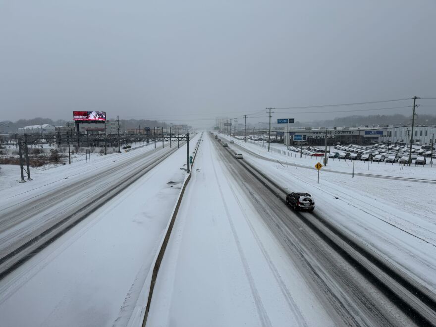Independence Boulevard at Idlewild Road in Charlotte is mostly covered with snow Saturday, Jan. 31, 2026.