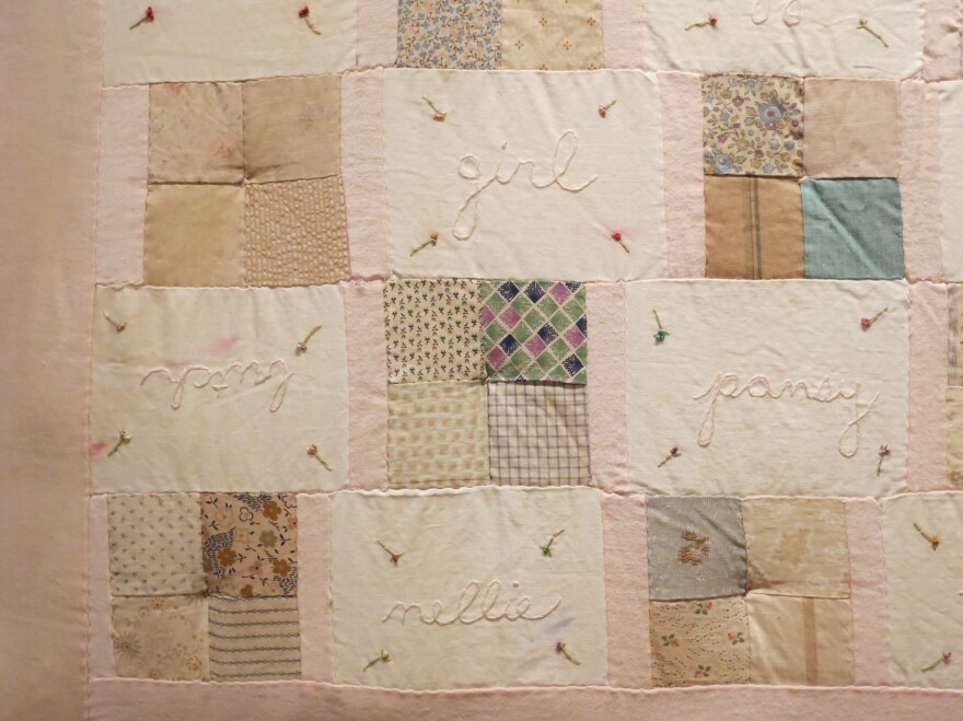 Melanie Braverman, <em>Queer, </em>1999-2000<em> </em><em>, </em>Antique fabric quilt patches, cotton thread, and silk ribbon, 64 x 49 in.