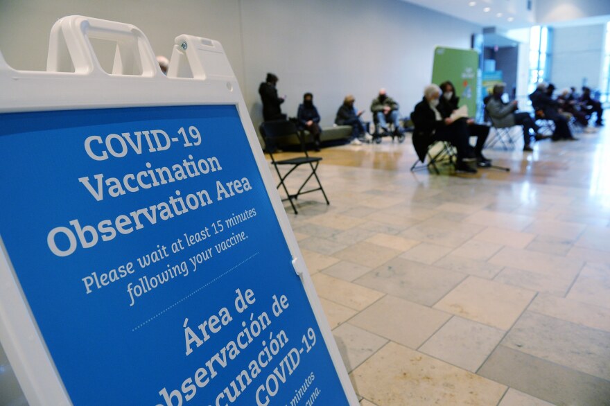 Seniors 75 and over wait 15 minutes in an observation area after receiving the first dose of the Moderna COVID-19 vaccine at the Connecticut Convention Center.