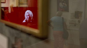 In this Sept. 15, 2010 photo, a video of Tammy Wynette is reflected in a glass case at the Tammy Wynette exhibit at The Country Music Hall of Fame in Nashville, Tenn. (Josh Anderson/AP)