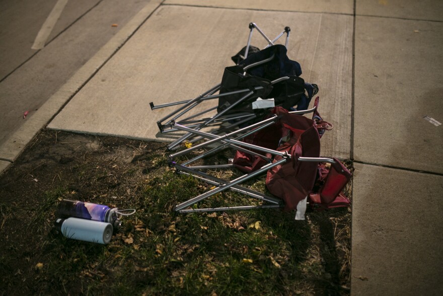 Debris litters the street at a crime scene on Nov. 21, 2021 in Waukesha, Wisconsin. SUV drove through pedestrians at a holiday parade, killing at least one and injuring 20 more.