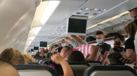 Passengers with facemasks boarding inside an Aegean Airbus A320. (Nicolas Economou/NurPhoto via Getty Images)