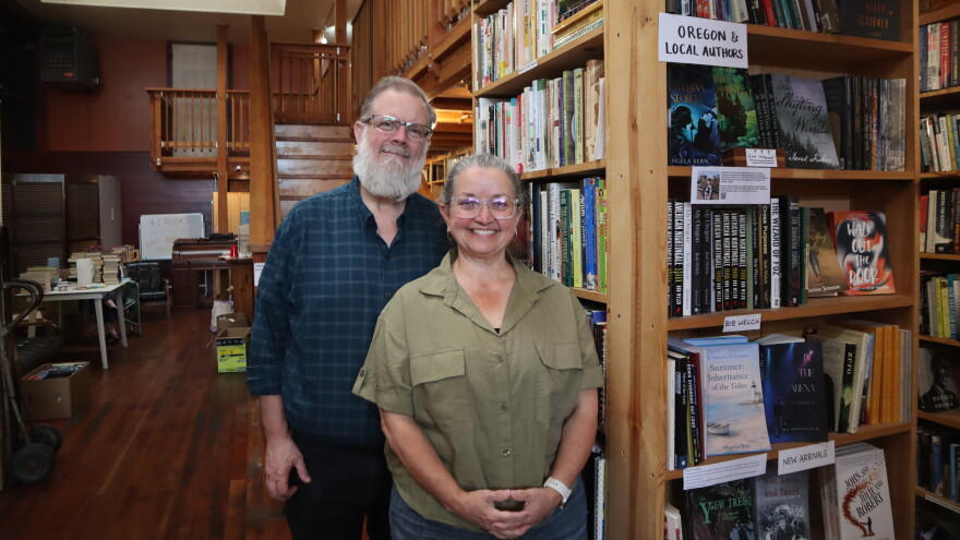 In this Sept. 1, 2026 photo, Wild Geese Books' new owners (from left) Bil and Julia Morrill are spending the days leading up to the stores opening cleaning and reorganizing the stock that came with the store when they bought it.