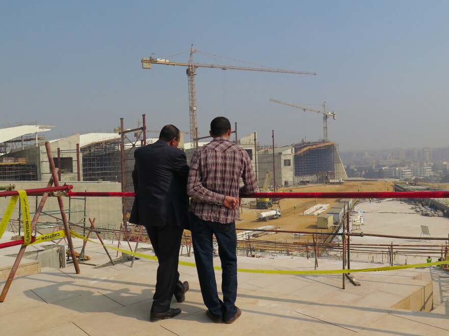 Two men survey the construction of Egypt's Grand New Egyptian Museum, which will be one of the largest in the world. It's due to open at the end of 2017.