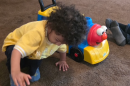 A child plays last week at his grandmother’s house where he now lives with his three siblings and four cousins, all who lost their parents in an ICE raid last month. The boy often stands by the door calling, “Mamá, mamá.”