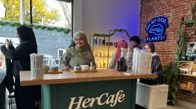 Co-founder Yasmen Hassen stands behind the HerCafe cart with her team just minutes before the popup begins.