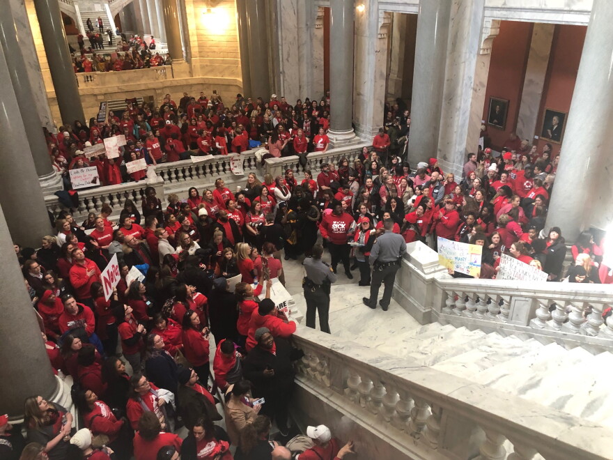 Teachers and their allies congregate at the base of the Kentucky House steps to protest a number of bills on day 25 of the 30-day session on March 6, 2019.