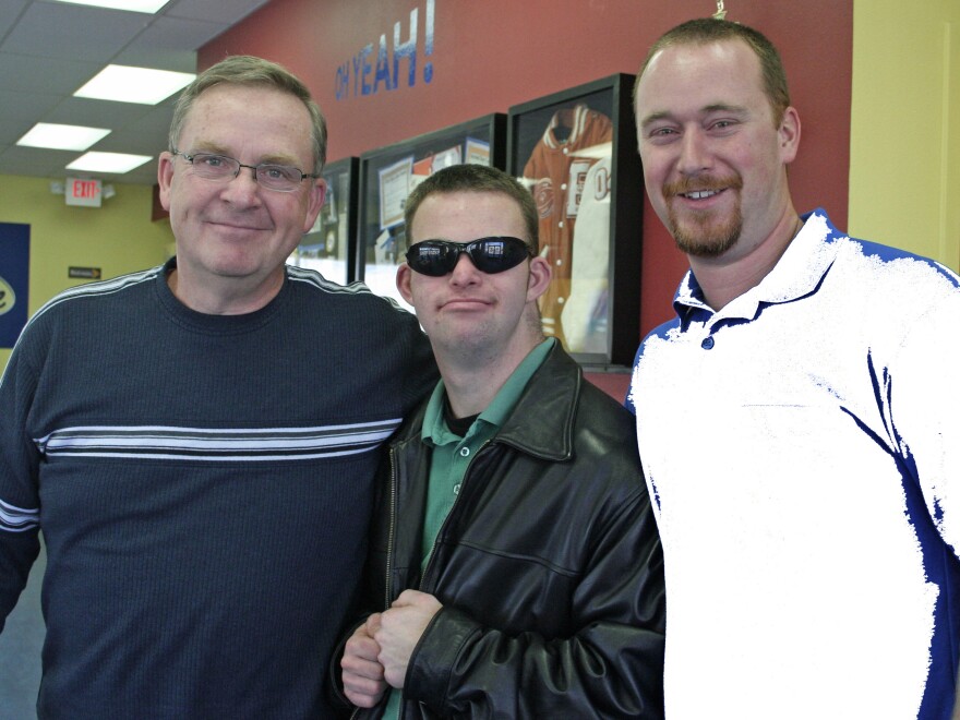 Tim with his father, Keith, and brother Dan (right) at Tim's Place. Dan is the restaurant's operations manager.