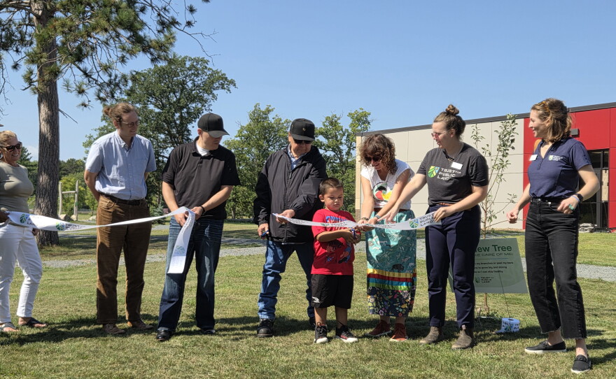 Representatives of the Red Lake Tribal Council, Endazhi-Nitaawiging Charter School and Trust for Public Land cut the ribbon for a new natural playground during a ceremony on Aug. 25, 2026.